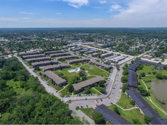 an aerial view of a city with many buildings and a parking lot