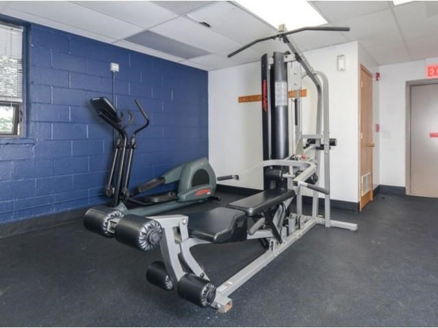 the gym has a lot of equipment in it