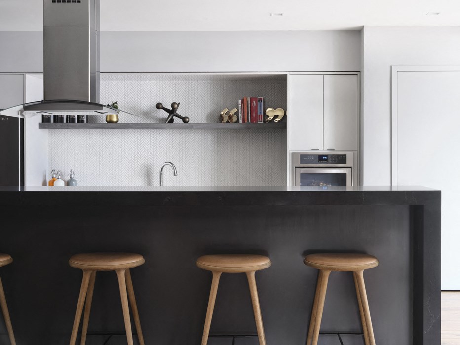 three wooden stools in front of a kitchen counter