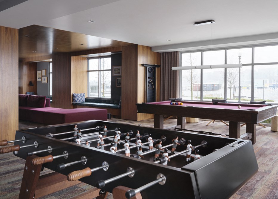 a game room with a foosball table and a pool table