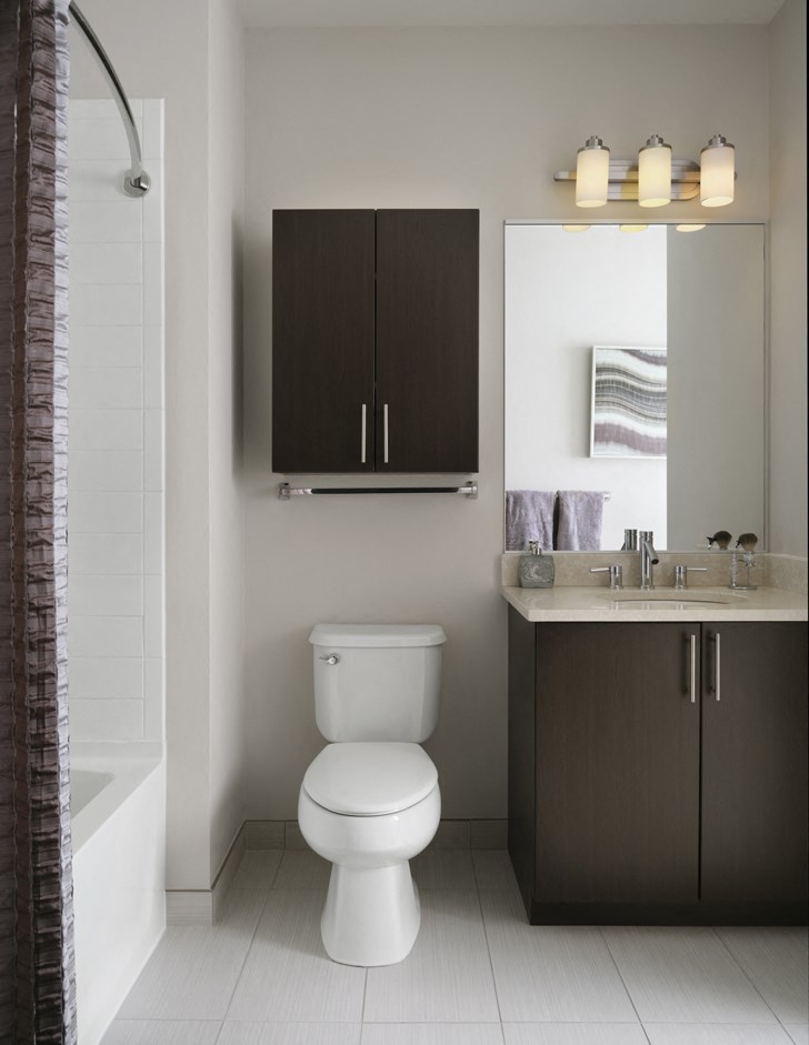 a bathroom with a toilet and a sink