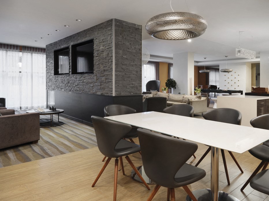 a dining room and living room with a table and chairs