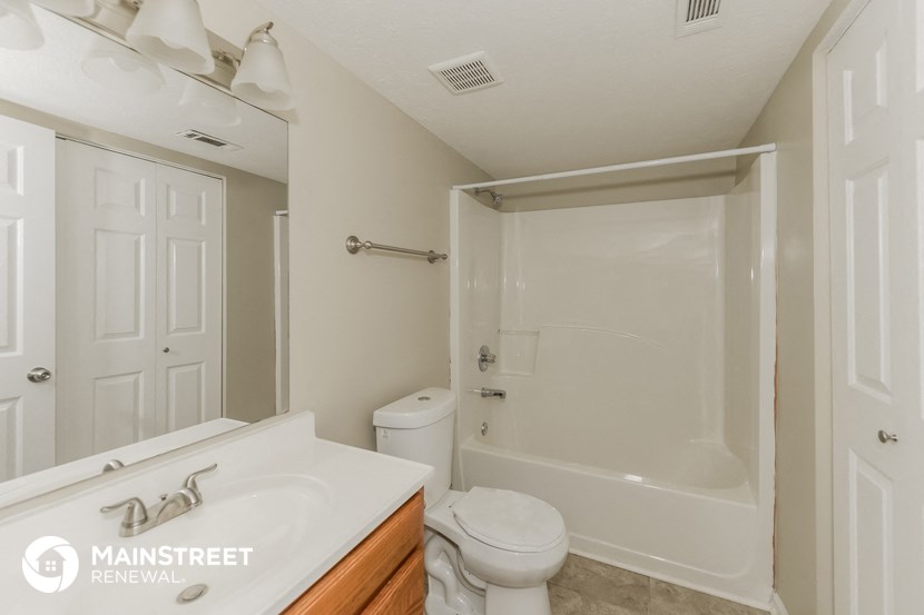 a bathroom with a sink toilet and a shower