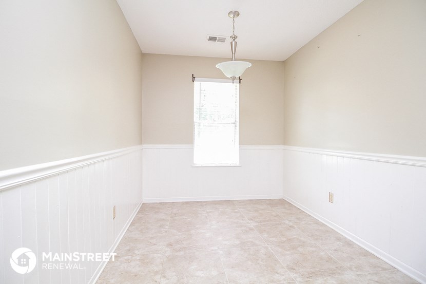 a empty room with white walls and a window