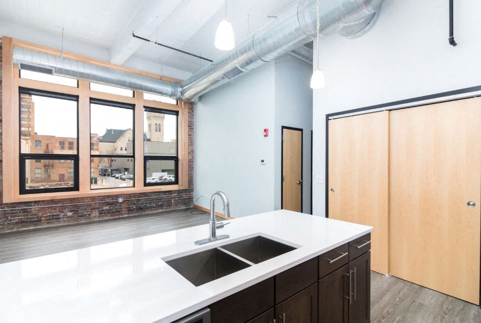 a kitchen with a sink and a window