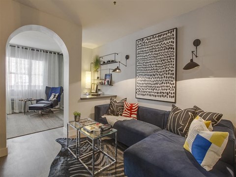 a living room with a couch and a table