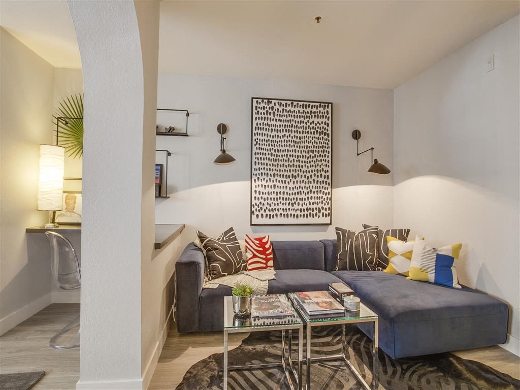 a living room with a couch and a table