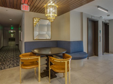 a dining room with a table and chairs