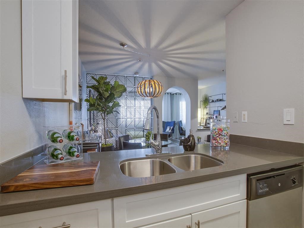 a kitchen with a sink and a window