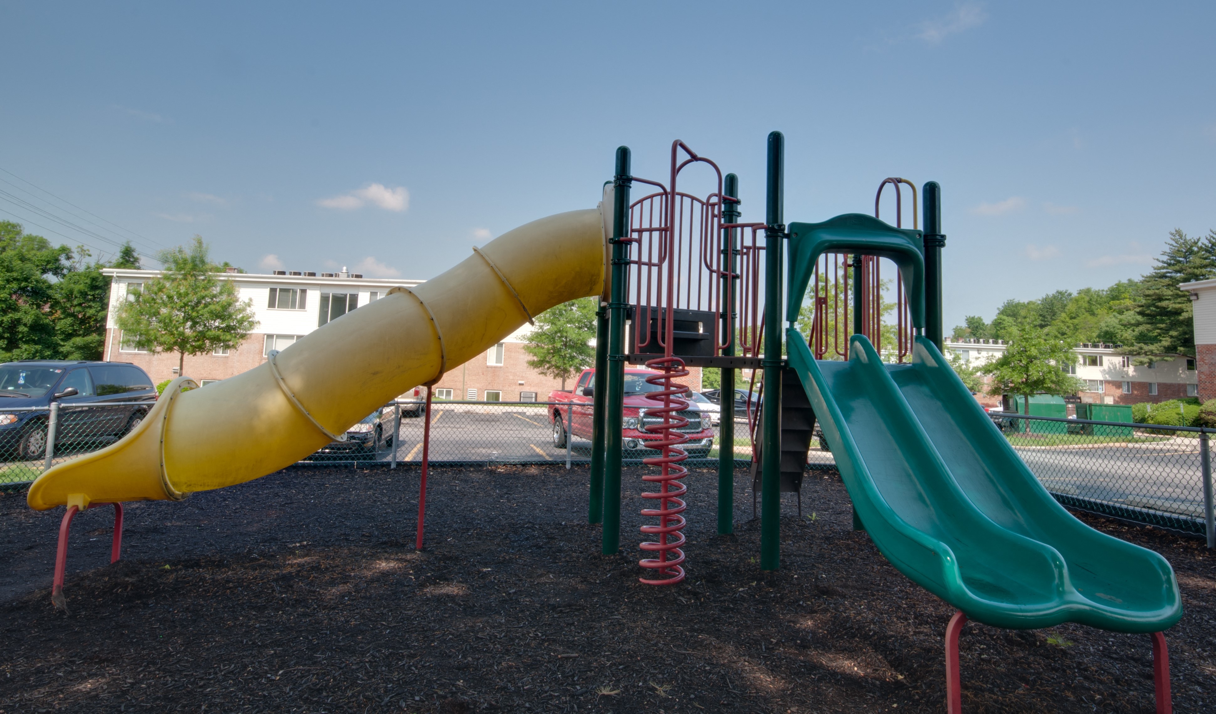 a playground with a slide and a tube