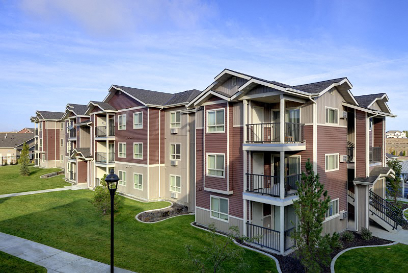 Pathway with grass to apt buildings Lafayette, CO Apartments For Rent at Copper Stone