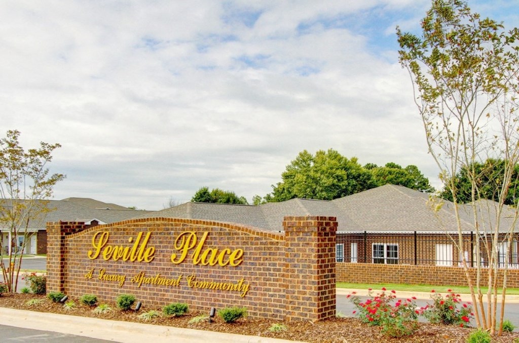 the front of a building with a sign that reads sandy place