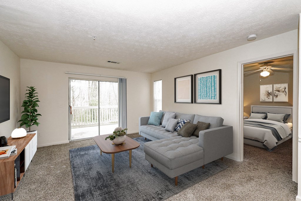 the living room of an apartment with a couch and a table