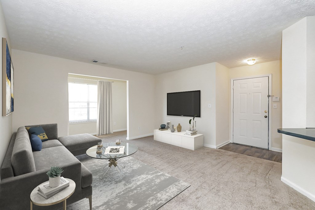 a living room with a couch and a tv