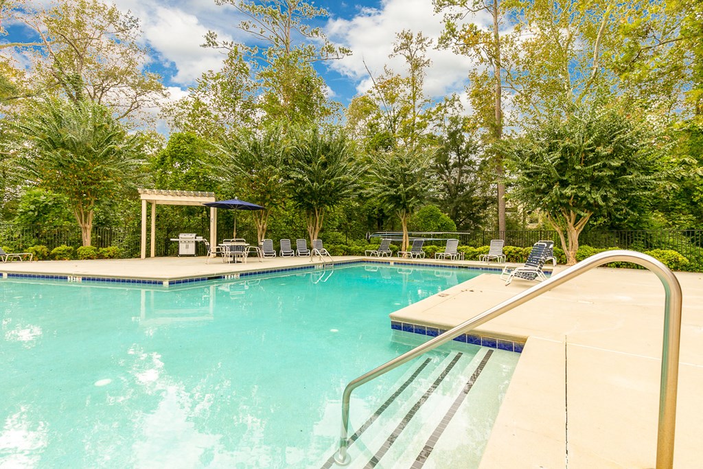 the swimming pool at the estates apartments