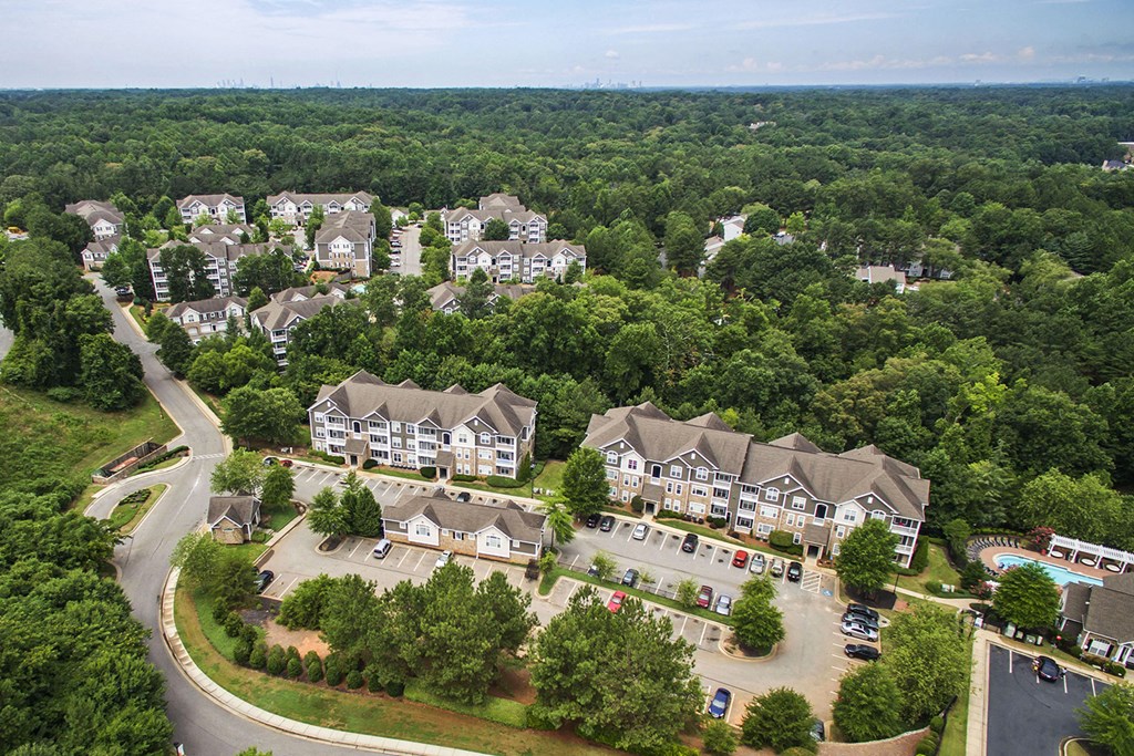 an aerial view of a neighborhood with houses and trees