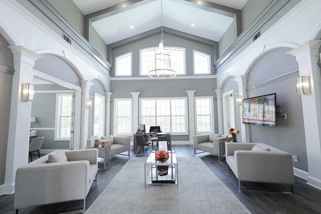 a large living room with couches and a table