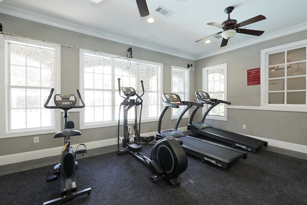 the gym has plenty of exercise equipment at the enclave at woodbridge apartments