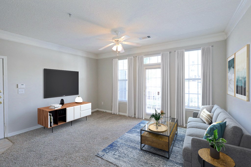 a living room with a couch and a tv