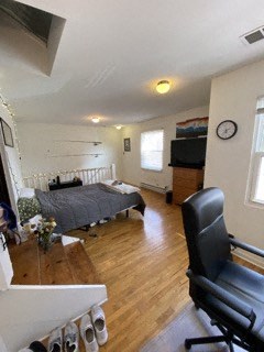 a room with a bed and a desk and a chair