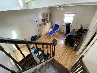 an overhead view of a living room with a blue chair