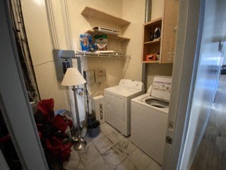 a small laundry room with a washing machine in it