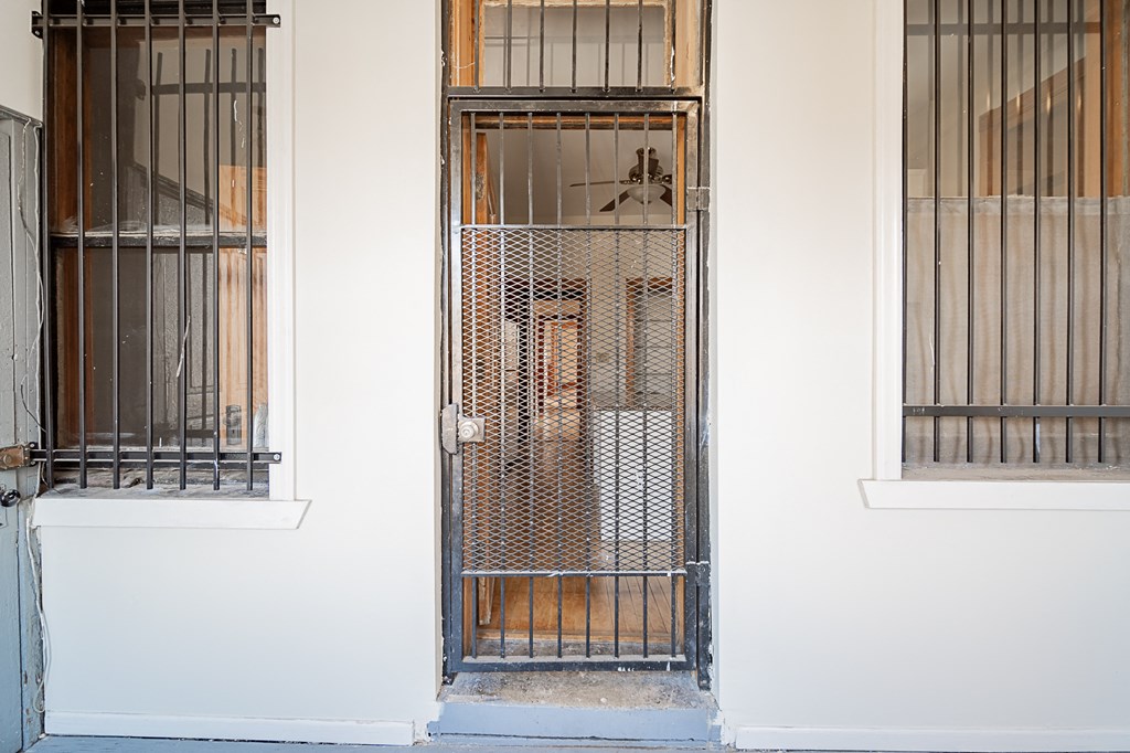 the front door of a house with bars on it