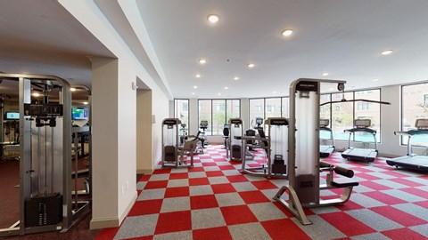 A gym with a red and white checkered floor.
