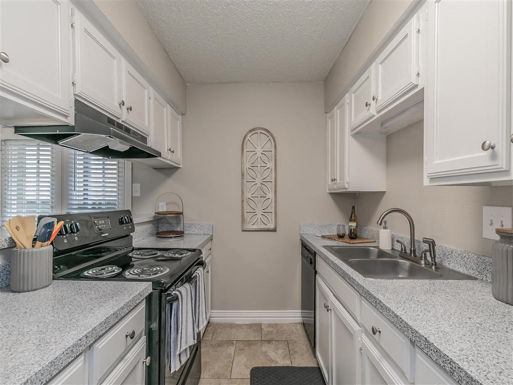 Fully equipped kitchen with granite countertops and stainless-steel appliances