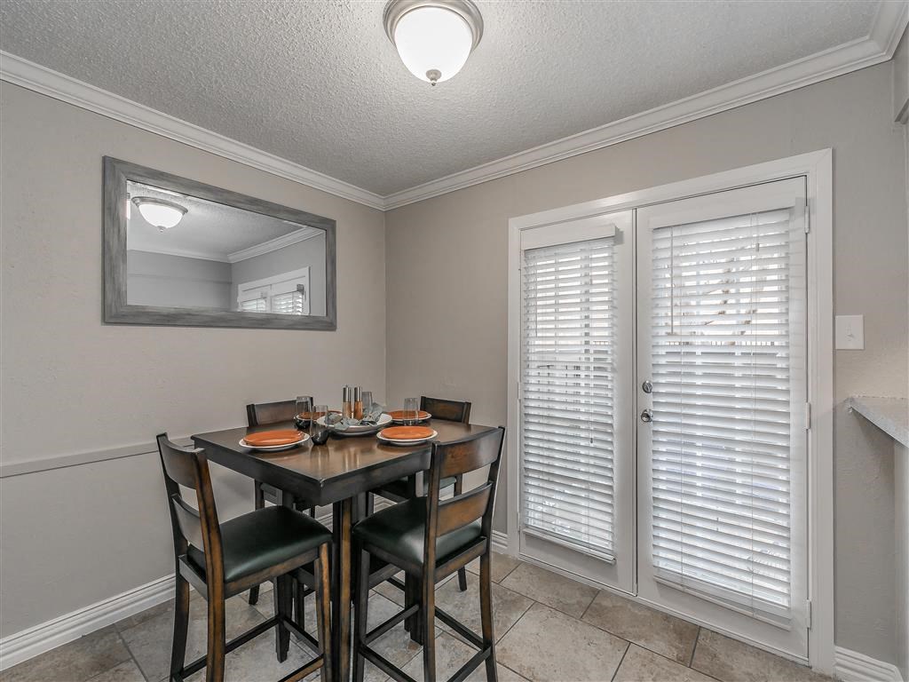 Cozy dining nook beside kitchen in upgraded Riata Park apartment