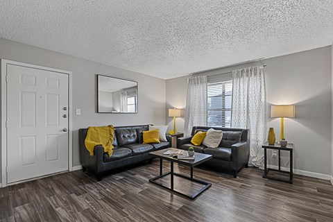 Living space with sectional sofa, coffee table, and décor