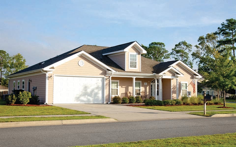 a house with a driveway and a garage door