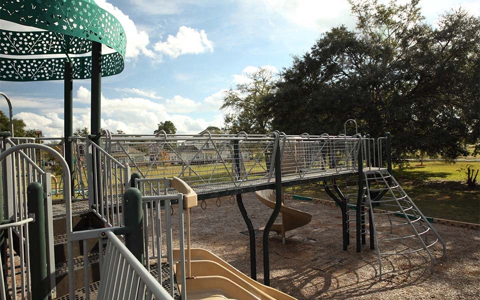 a playground with slides and a swing set