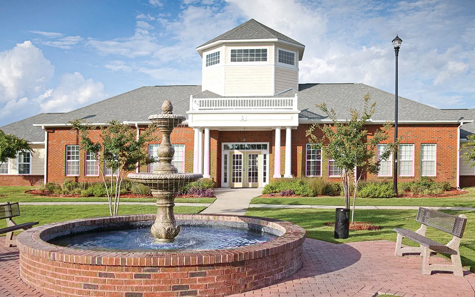 a fountain in front of a building