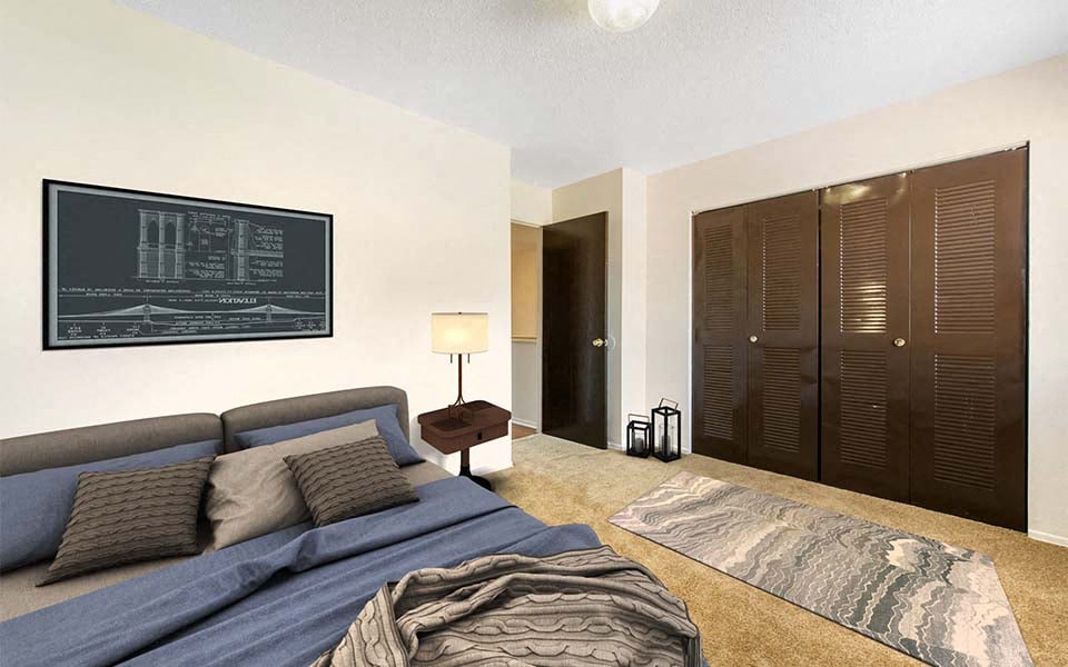 a living room with a couch and a chalkboard on the wall