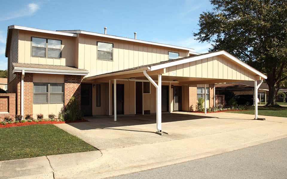 a house with a covered porch and a driveway