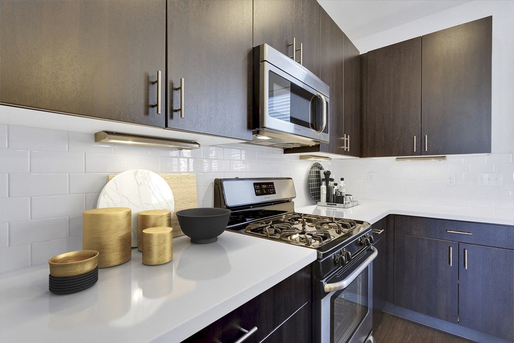 a kitchen with a stove and a microwave