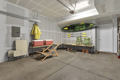 a room filled with furniture and a surfboard on the wall