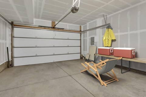 a room with a chair and a garage door