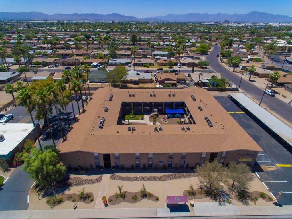an aerial view of a building in the middle of a city
