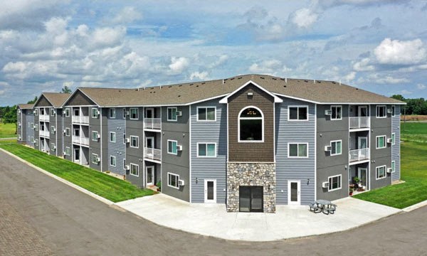 an apartment building on the side of a road