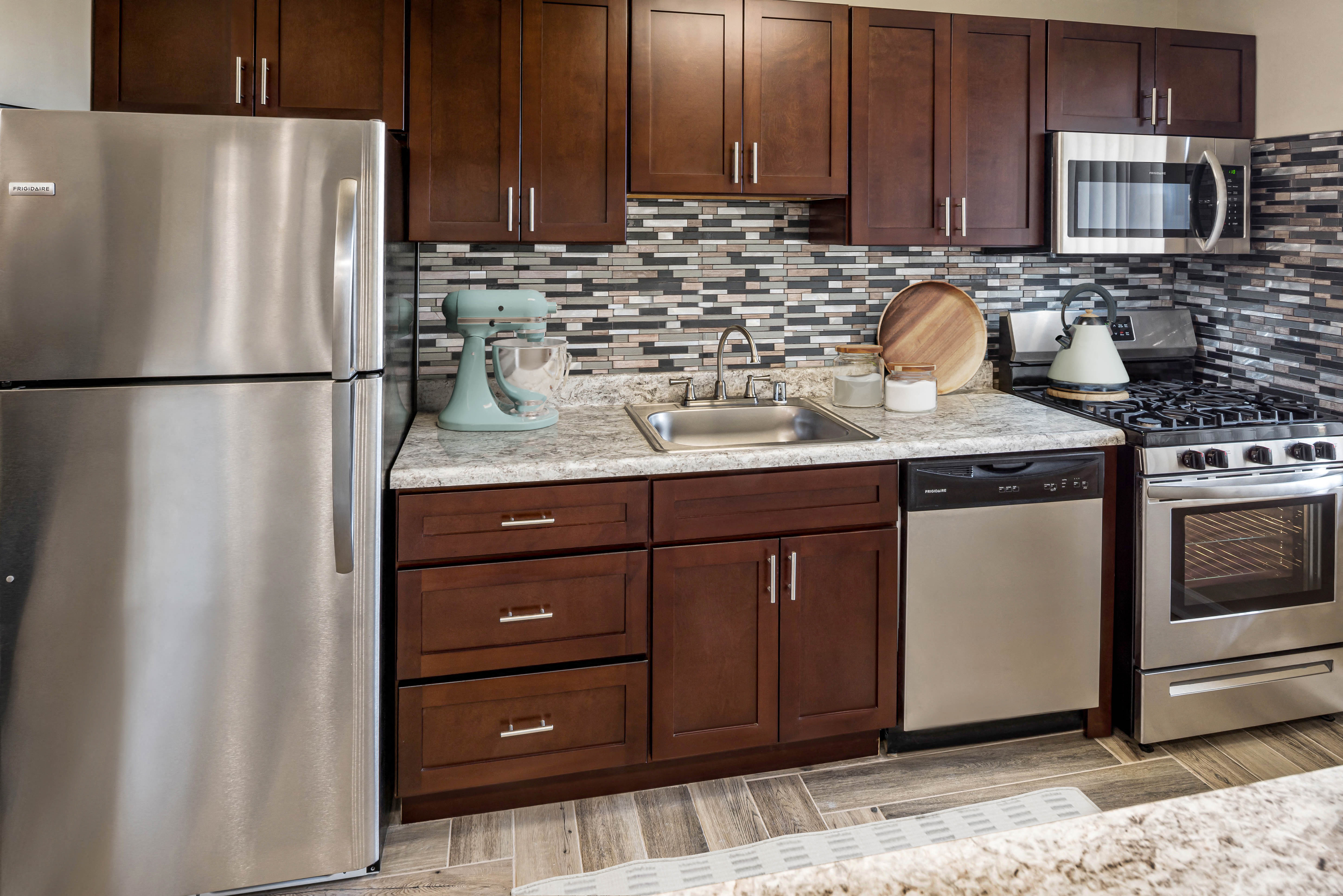 Middletowne kitchen mahogany cabinets and stainless steel appliances