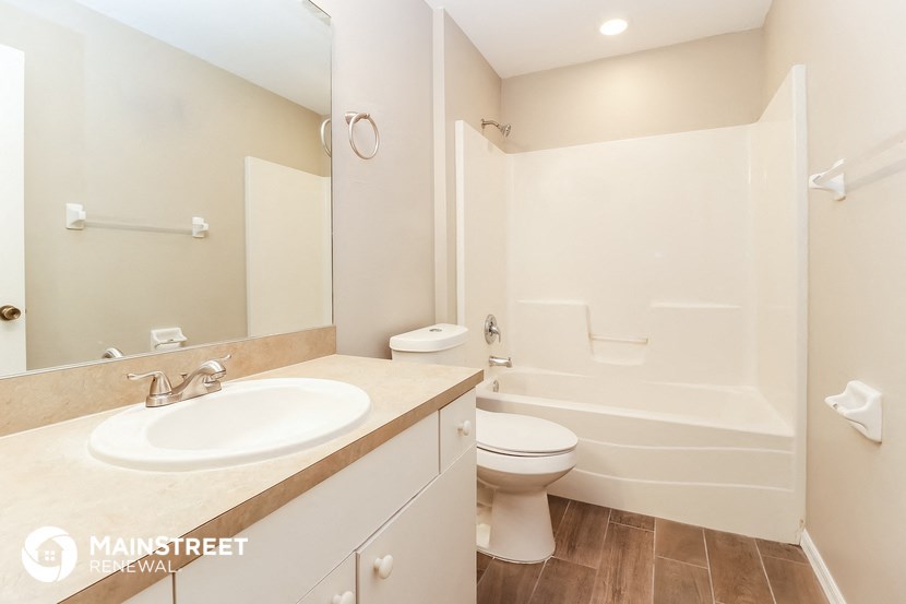 a bathroom with a sink toilet and a shower