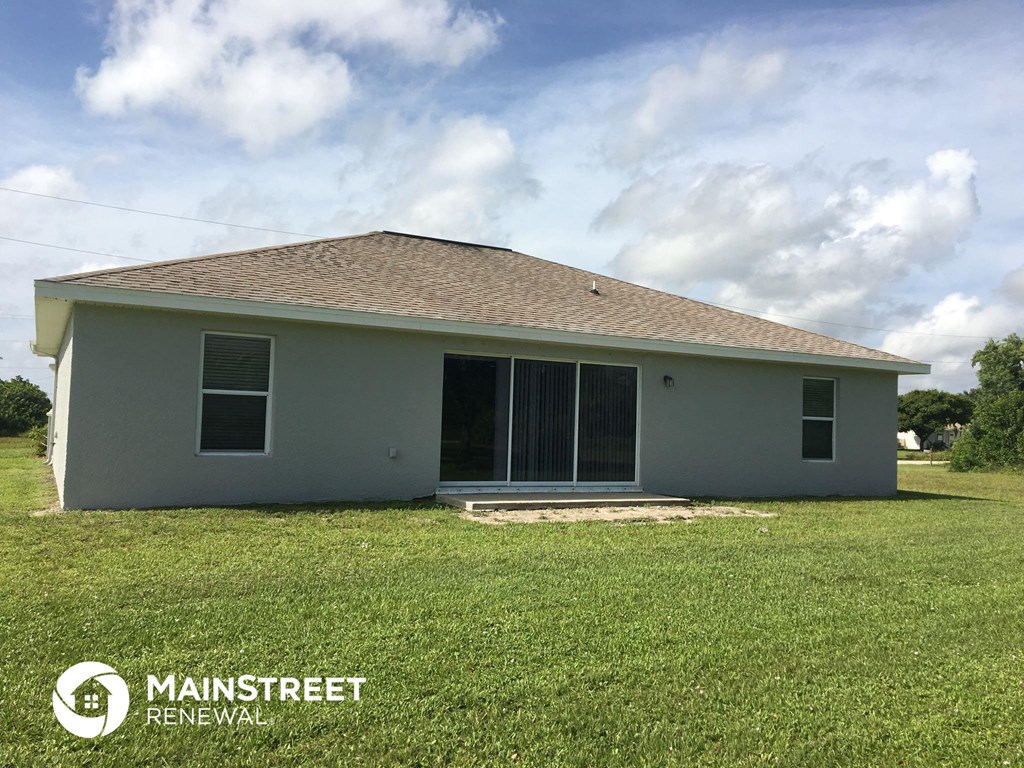 a small house with a lawn in front of it