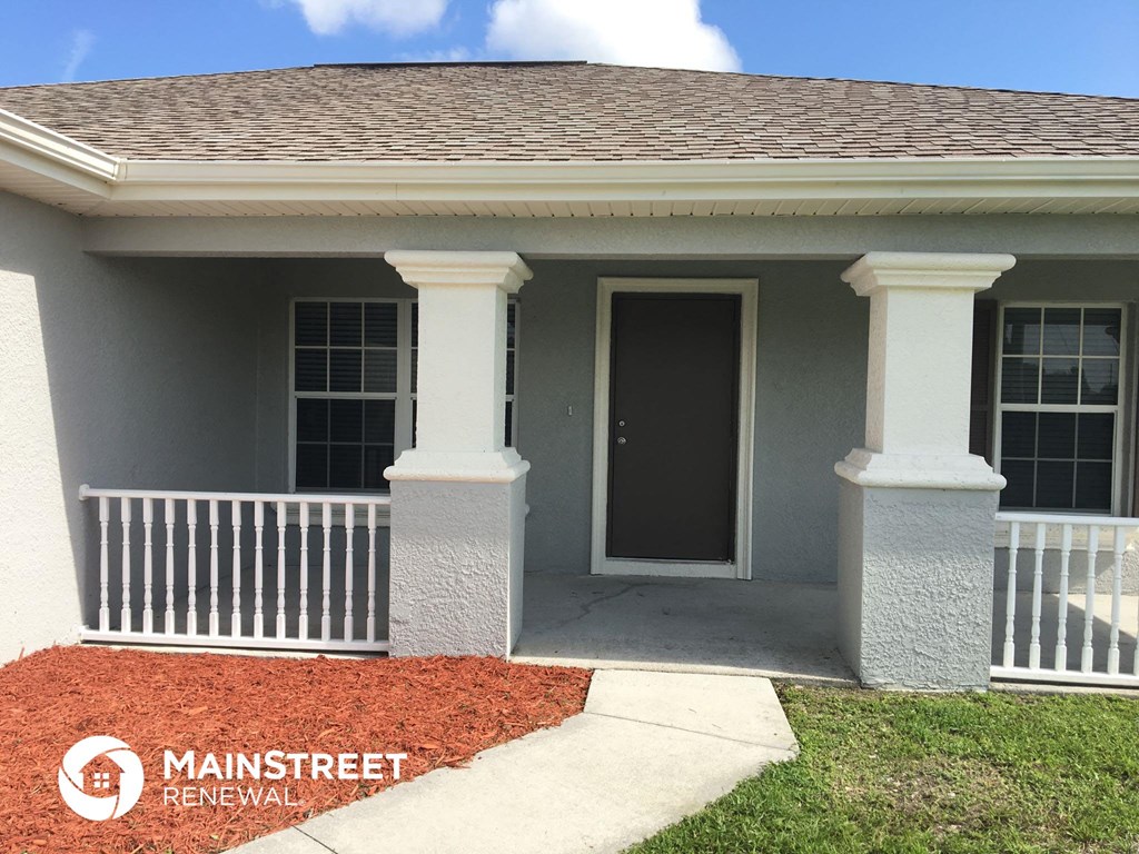 a home with a front porch and a front door