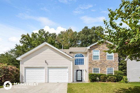 a brick house with a white garage door