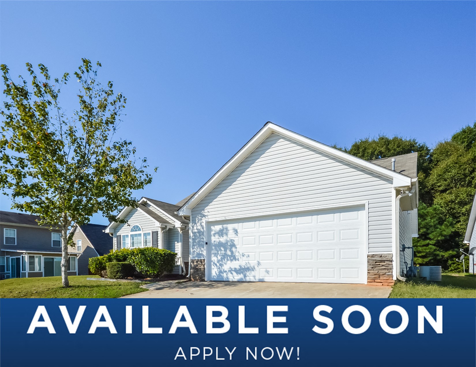 a small white house with a white garage door