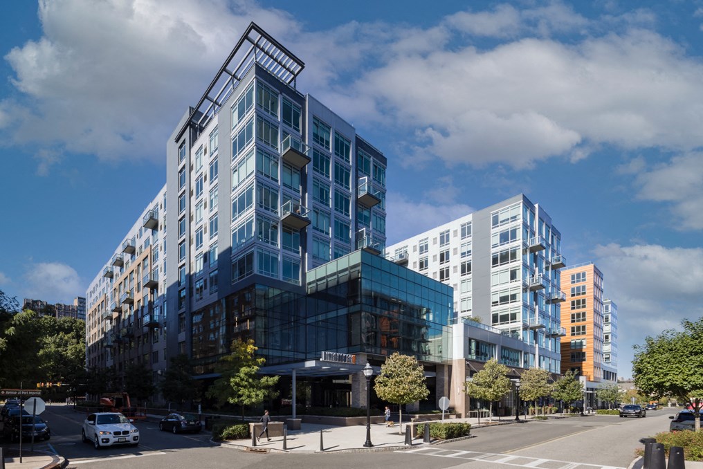 a large blue building on the corner of a city street