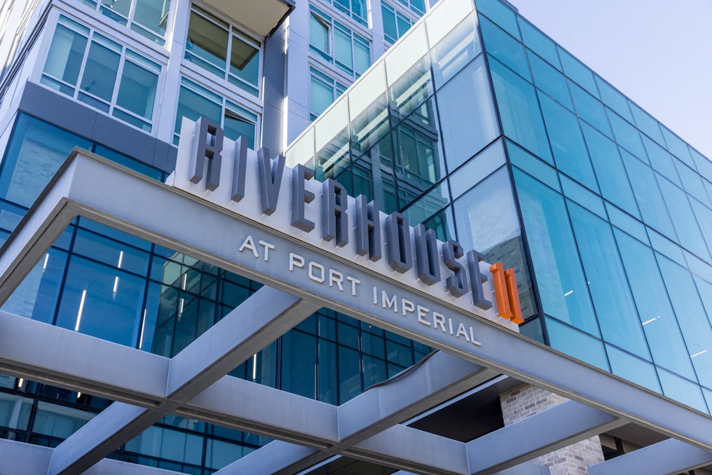 the front facade of a building with a large sign on top of it