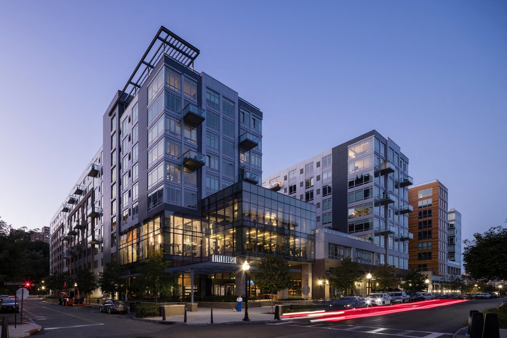 a large building on a city street at night